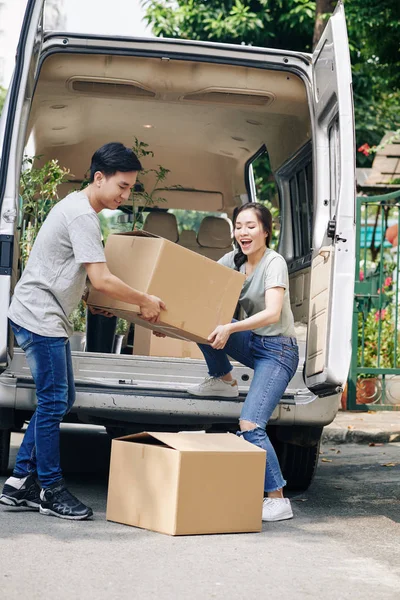 Cheerful Young Asian Couple Unloading Truck Belongings Moving New House — ストック写真