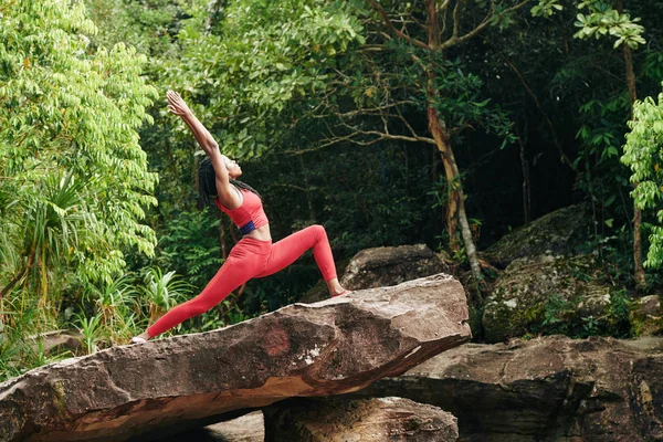 Slim Young Woman Standing Rock Tropical Forest Doing Warrior Pose — Stock Photo, Image
