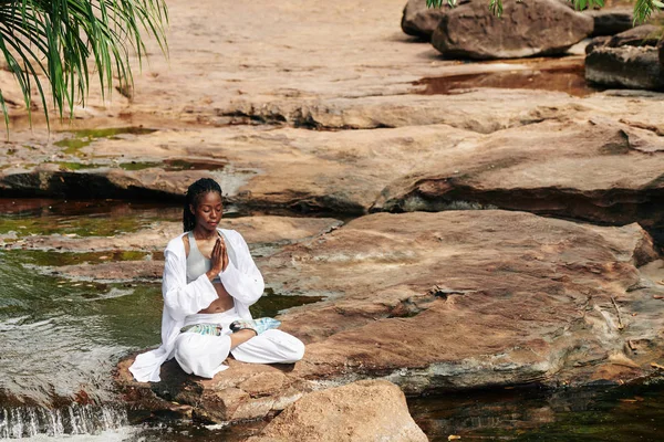 Beautiful Calm Young Black Woman Sitting Rock Creek Holding Hands — Stock Photo, Image