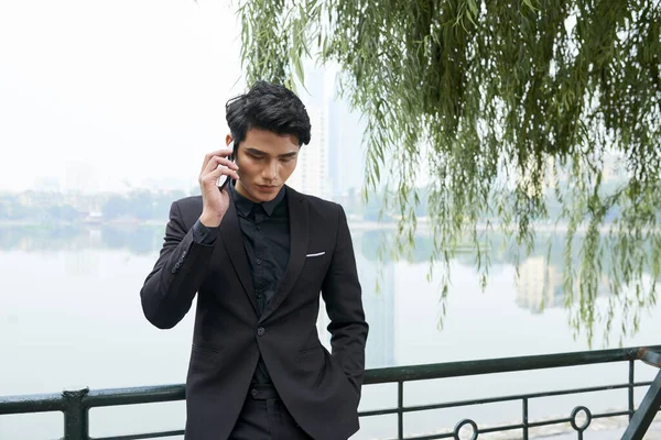 Horizontal Shot Young Businessman Wearing Stylish Black Suit Standing River — Stock Photo, Image