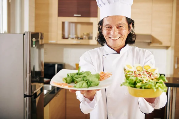 Portrait Happy Smiling Man Showing Plates Appetizers Salad Cooked Dinner Stock Picture