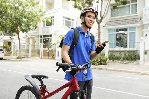 Smiling Young Vietnamese Delivery Man Standing Next His Bicycle Smartphone — Stock Photo, Image