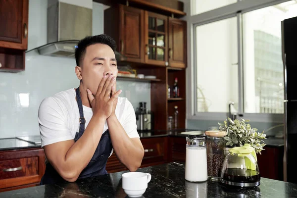 Yawning Young Handsome Vietnamese Man Sitting Kitchen Counter Drinking Morning — Stock Photo, Image