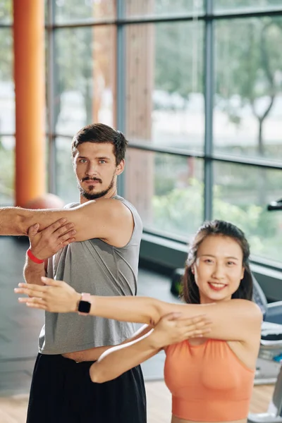 Positive Multi Ethnic Young People Stretching Arms Warming Training — Stock Photo, Image