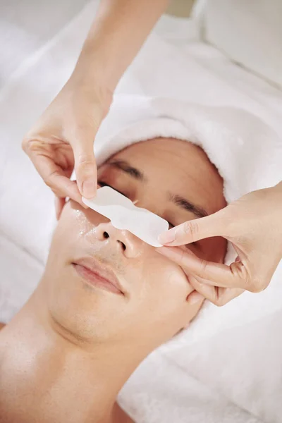 Cosmetologist Applying Blackhead Remover Sticker Nose Male Client — Stock Photo, Image