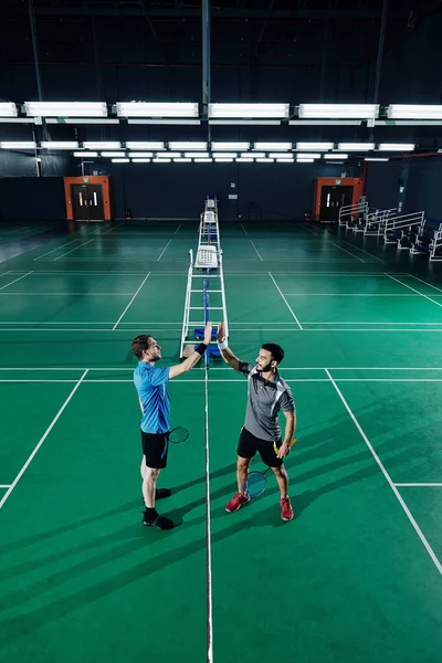 Cheerful Badminton Players Giving Each Other High Five Finishing Game — Stock Photo, Image