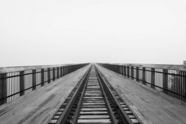 Located in Allegheny National Forest, the Kinzua bridge used to be the tallest and longest railroad structure. Now it is an overlook over the mountains. However, on this morning, it is covered in fog  clipart