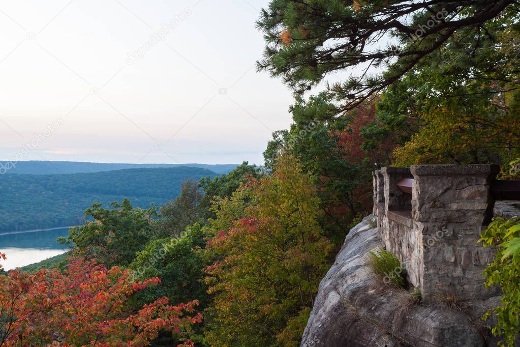 Sunset at rimrock overlook in Allegheny National Forest. The view includes mountains, autumn color, the river, the reservoir, the overlook, the sky, and sunset. It was a beautiful evening.