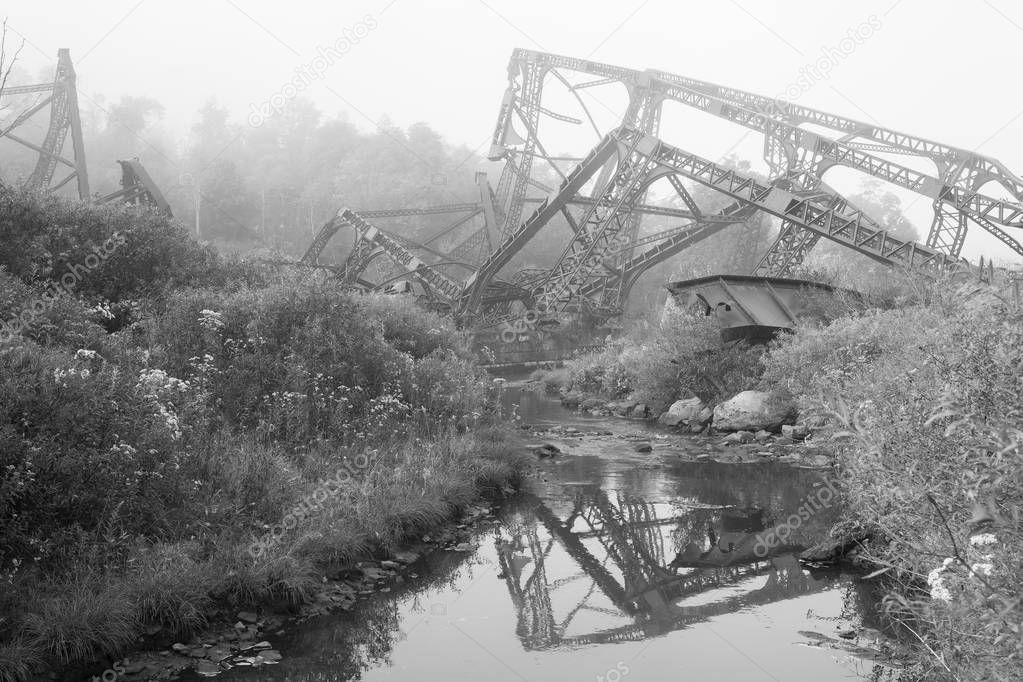 Mangled metal framework from the Kinzua bridge. The kinzua bridge used to be the tallest and longest railroad structure for trains. Part of it collapsed after a tornado hit it.