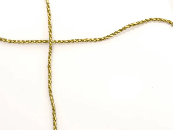 Corda dourada isolada em branco — Fotografia de Stock