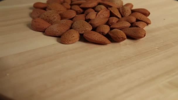 Handful Almonds Rotating Wooden Background Copy Space — Stock Video