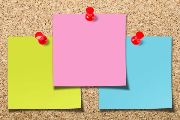 Cork board with three sticky notes