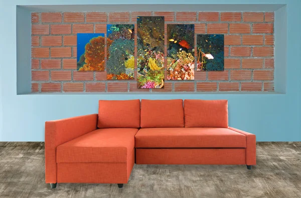 orange sofa furniture and underwater photo collage on brick wall