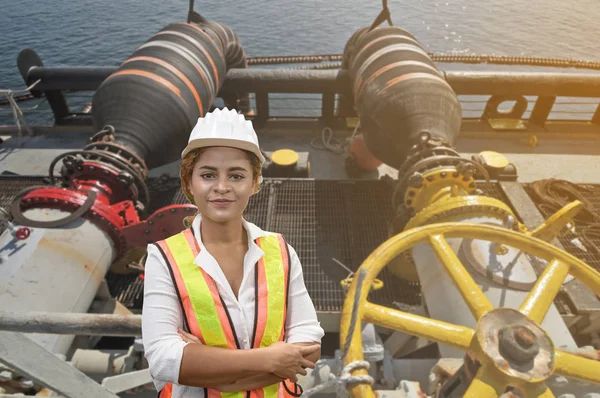 mixed race woman engineer staff worker and offshore oil load ves