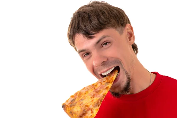 Hombre guapo emocionalmente comer pizza rebanada —  Fotos de Stock