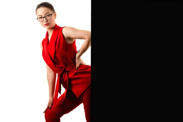 Fashionable business woman in red suit on black and white — Stock Photo, Image