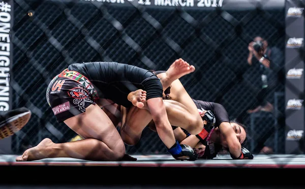 Rika Ishige "Tiny Doll" of Thailand and Audreylaura Boniface of Malaysia in One Championship "One : Warrior Kingdom" Stock Photo