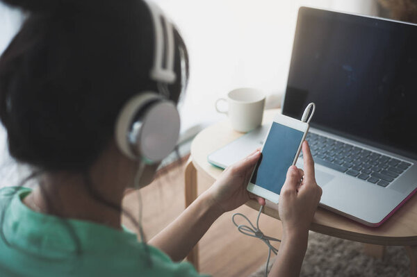 Young Asian woman using laptop computer