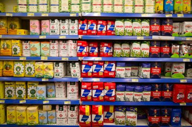 Buenos Aires, Argentina - January, 2020: Big variety of mate tea in a row in supermarket. Rows of packs of herbal mate tea traditional hot drink in Latin America. clipart