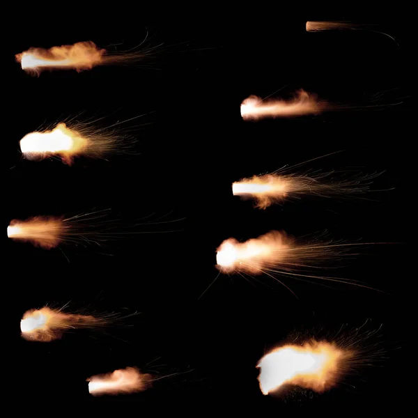 A shot from a firearm on a black background, a fiery exhaust with flying sparks, flames bursting out of the pipe. Fire comes out of the nozzle of a jet engine
