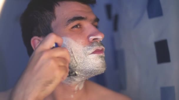 Young Man Shaves Bathroom Shaving Foam Face — 图库视频影像