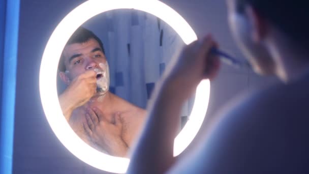 Young Man Shaves Bathroom Shaving Foam Face — Stock Video
