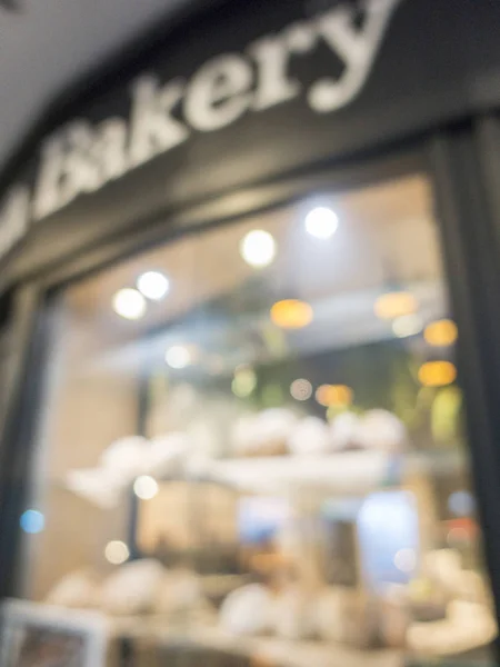 Blurred bakery shop, vertical background.