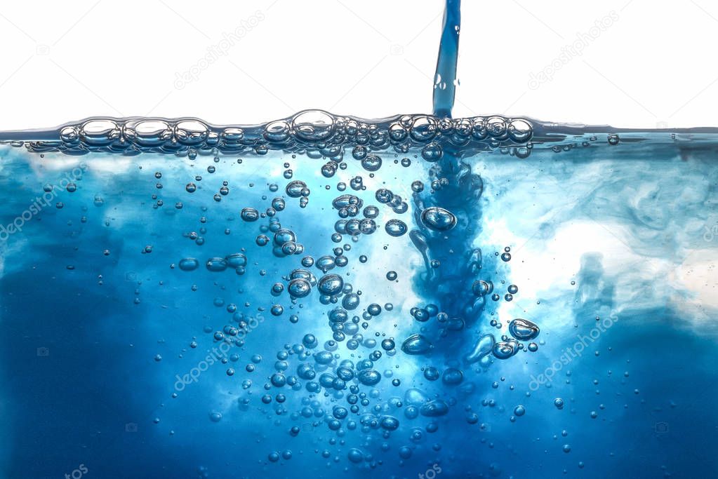 Pouring blue Water Splash Bubbles and Drops