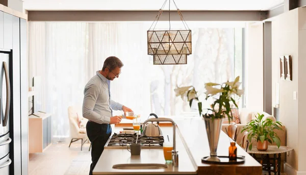 Businessman Pouring Orange Juice Modern Kitchen — Stock Photo, Image