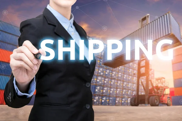Smart Business woman is writing shipping word with cargo shipping containers in shipping yard.