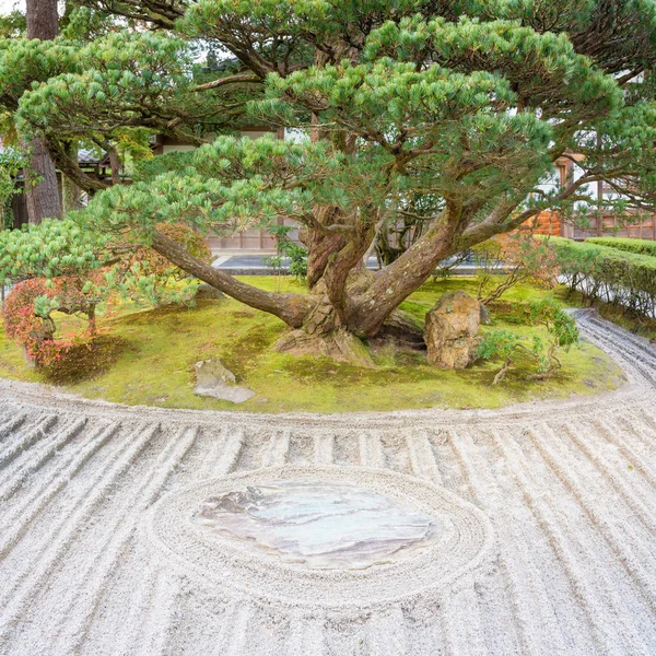 Japanese zen garden meditation stone in lines sand for relaxation