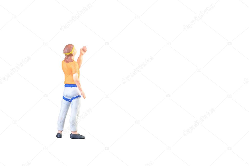 Close up of Miniature people doing climbing sport isolated with clipping path on white background