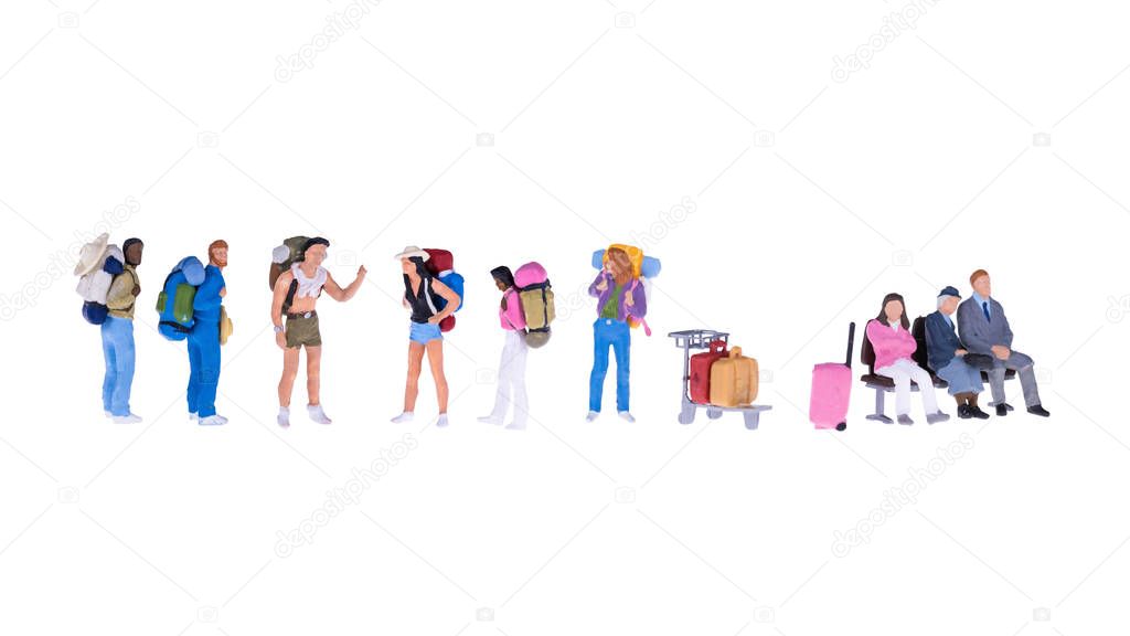 Close up of Miniature backpacker and tourist people isolate on white background. 