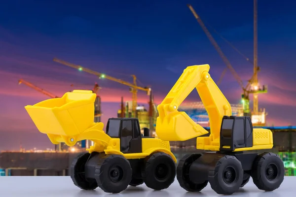 Heavy duty construction backhoe and Tractor toy with construction site in background