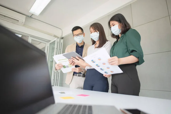 Business employees wearing mask during work in office to keep hygiene follow company policy.Preventive during the period of epidemic from coronavirus or covid19.