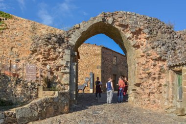 View at fortress gate on medieval village of Figueira de Castelo Rodrigo and medieval buildings clipart