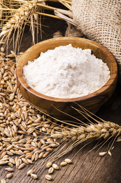 ears of wheat with flour and cereals