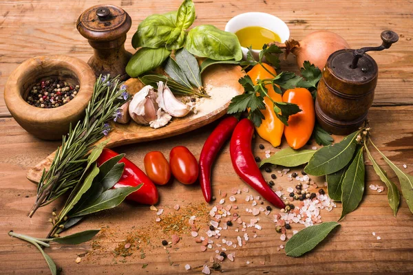 Rustic Wooden Table Spice Herbs Olive Oil Some Vegetables Accessories — Stock Photo, Image