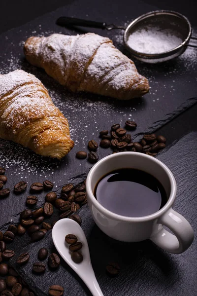 Cup Black Coffee Foreground Croissants Veiled Sugar Dark Background — Stock Photo, Image