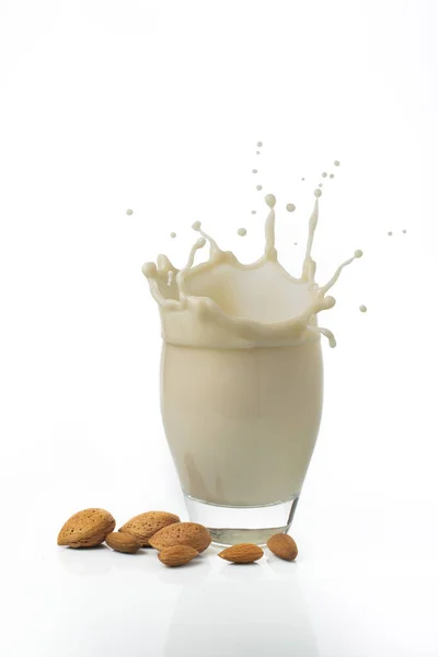 Isolated White Background Some Almonds Glass Almond Milk Splash — Stock Photo, Image