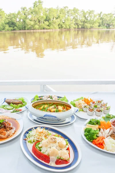Asian cuisine set with scenic view on riverside. — Stockfoto