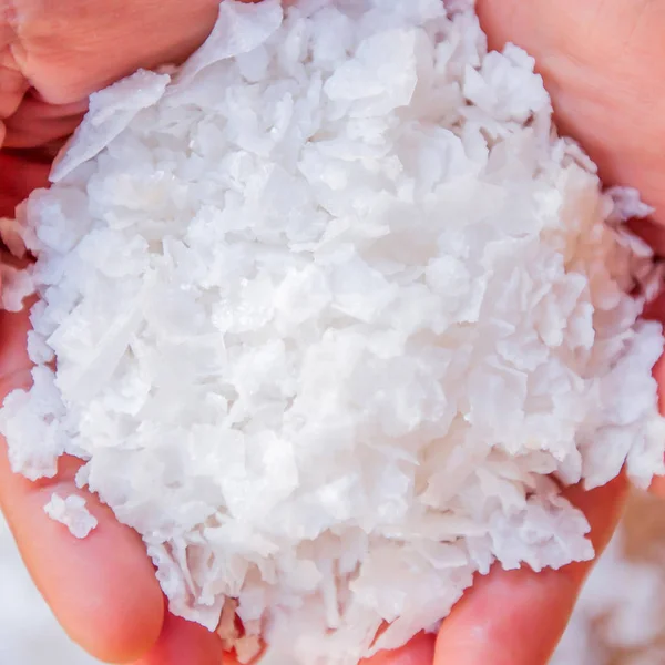 Rock salt in woman hands. — Stock Photo, Image