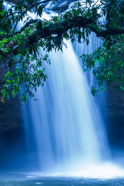 Fantastic tropical waterfall under the moonlight.