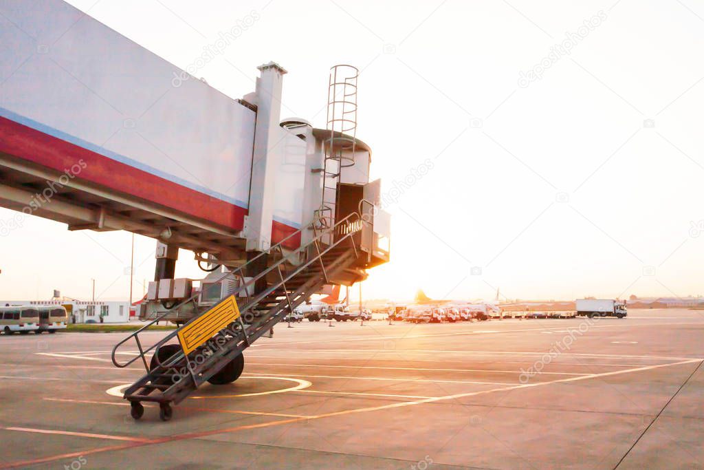 The jet bridge being moved to an airplane.