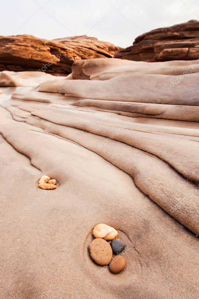 Beautiful pebbles and lines in steep sandstone.