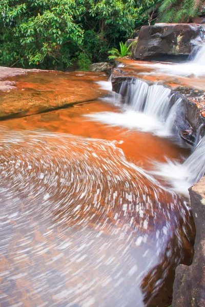 Soft streamlet falling on layers of sandstone. — Stock Image Soft streamlet falling on layers of sandstone. Stock Picture