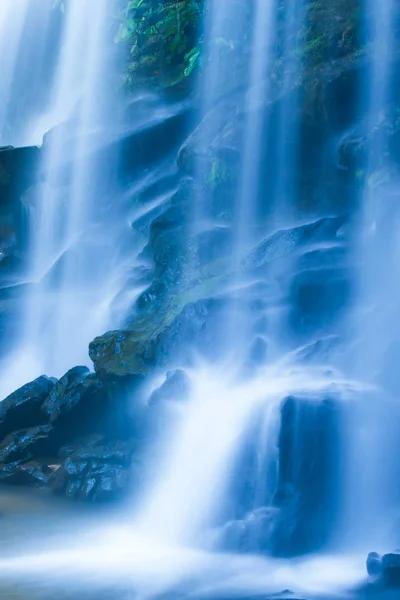 Picturesque tropical waterfall on summer morning. — Stock Image Picturesque tropical waterfall on summer morning. Royalty Free Stock Photos