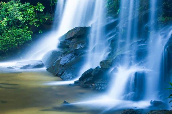 Picturesque tropical waterfall on summer morning. — Stock Image Picturesque tropical waterfall on summer morning. Stock Image