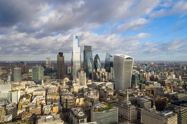 London city centre aerial panorama view: financial district, Thames river, Belfast, skyscrappers, warf and buildings and St. Pauls Cathedral, Tower Bridge and The Tower