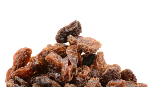 Raisins or dried grape gyrating on white background — Stock Video